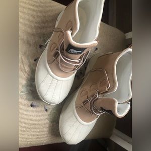 Sorel water proof booties. Worn once then had foot surgery.  No longer fit.